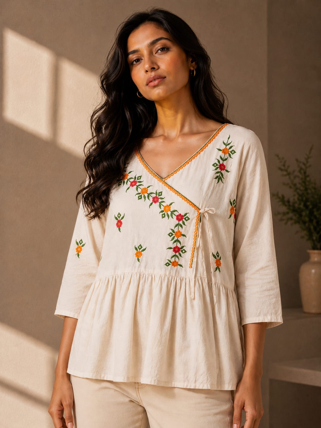 Embroidered Peplum Top